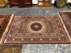 A MACHINE MADE RUG OF PERSIAN DESIGN 226 x 159 cms