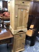 A PAIR OF PINE BEDSIDE CUPBOARDS, EACH WITH A DRAWER OVER A PANELLED DOOR AND BRACKET FEET.