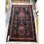 A BELOUCH TRIBAL RUG 196 x 123