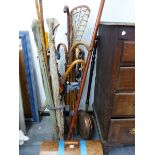 A CAST IRON STICK STAND, VARIOUS WALKING STICKS, A BED WARMING PAN, A SEWING MACHINE, SHOOTING