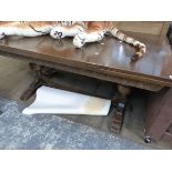 A LARGE OAK DRAW LEAF TABLE