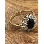 A 9ct HALLMARKED GOLD CZ CLUSTER RING IN A CLAW SETTING. FINGER SIZE P 1/2. WEIGHT 2.34grms.