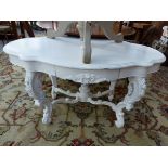 A ROCOCO STYE PAINTED CENTRE TABLE WITH CARVED DECORATION WITH TWO DRAWERS.