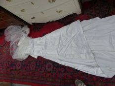A VINTAGE SILK WEDDING GOWN IN A DICKINS AND JONES BOX.