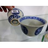 A PAIR OF ORIENTAL BLUE AND WHITE SMALL BOWLS WITH RING MARKS TO BASE.