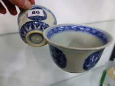 A PAIR OF ORIENTAL BLUE AND WHITE SMALL BOWLS WITH RING MARKS TO BASE.