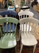 A SET OF FOUR KITCHEN CHAIRS PAINTED IN VARIOUS COLOURS