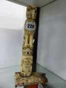AN ALERT BAY VICTORY TOTEM IN PRE GLACIAL IVORY WITH FURTHER INSCRIPTIONS. H 25.5cms.