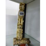 AN ALERT BAY VICTORY TOTEM IN PRE GLACIAL IVORY WITH FURTHER INSCRIPTIONS. H 25.5cms.