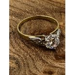 A 9ct HALLMARKED GOLD CZ SOLITAIRE WITH STONE SET SHOULDERS. FINGER SIZE O. WEIGHT 2.85grms.