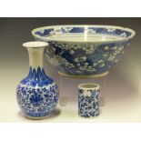 A CHINESE BLUE AND WHITE BOWL PAINTED WITH CHERRY BLOSSOMS. Dia 34.5cms. A BLUE AND WHITE BRUSH