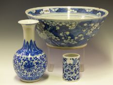 A CHINESE BLUE AND WHITE BOWL PAINTED WITH CHERRY BLOSSOMS. Dia 34.5cms. A BLUE AND WHITE BRUSH