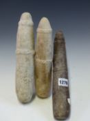 THREE WEST AFRICAN STONE PESTLES,EACH WITH RELIEF CARVED BANDS, TWO OF MARBLE AND THE LARGEST IN RED