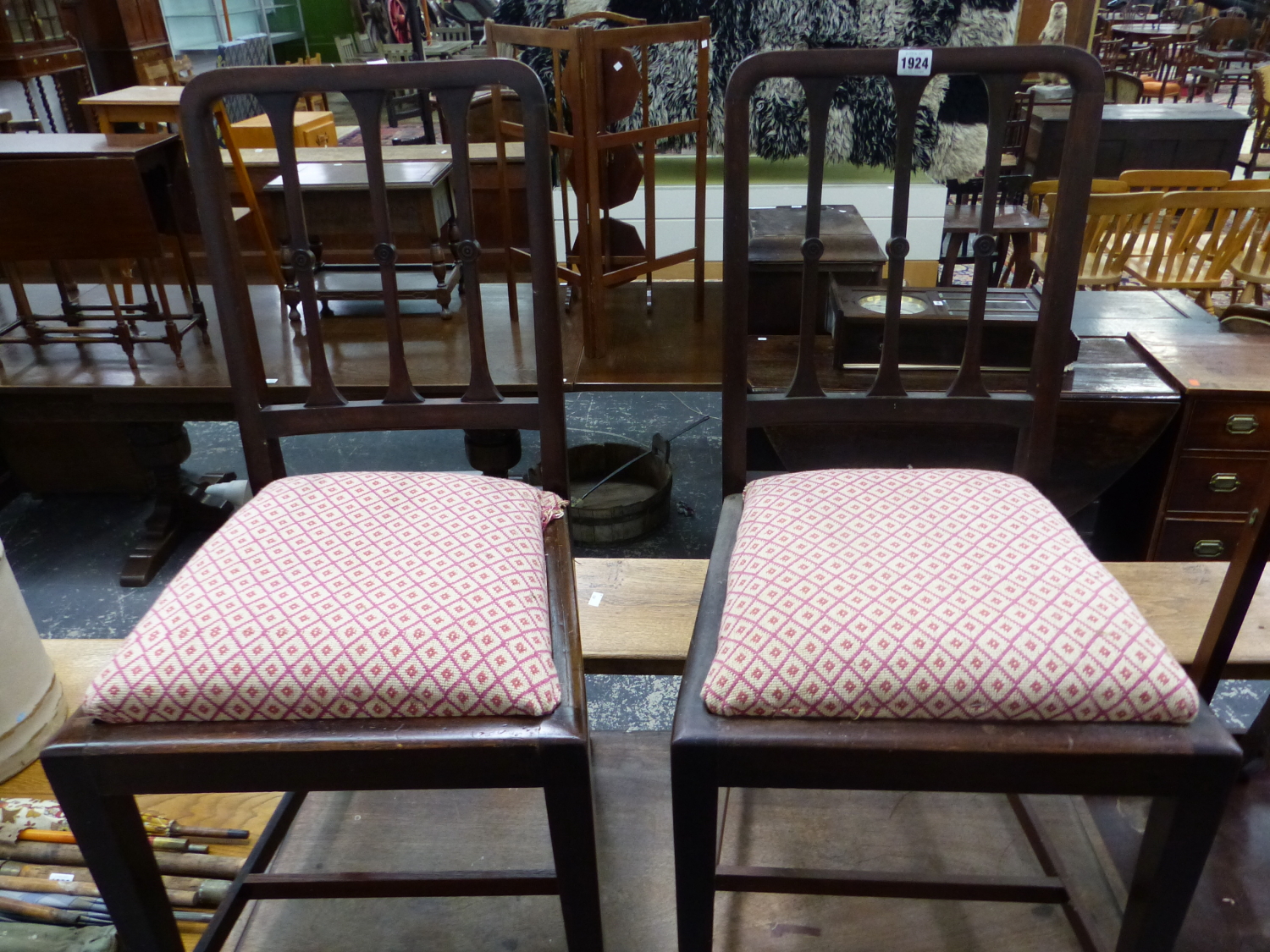 A PAIR OF MAHOGANY CHAIRS WITH THREE VERTICAL BAR BACKS, DROP IN SEATS AND TAPERING SQUARE LEGS