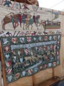 THREE WALL HANGINGS. ONE OF ARMORIAL DESIGN. A FRAGMENT OF THE BAYEAUX TAPESTRY AND ANOTHER OF