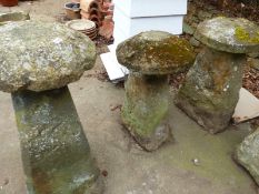 A GROUP OF THREE LARGE ANTIQUE STADDLE STONES