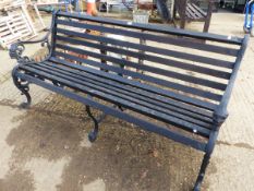 A PAINTED GARDEN BENCH WITH IRON SUPPORTS. H 79 x W 159 x D 50cms