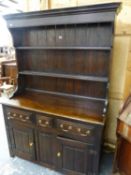 A BESPOKE OAK HUTCH/DRESSER, THE ENCLOSED SHELF BACK ABOVE THREE DRAWERS AND TWO DOORS. W 128 x D