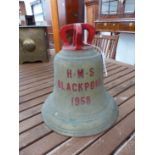 THE 1958 BELL FROM HMS BLACKPOOL, THE CROWN TOP PAINTED RED. H 29cms.