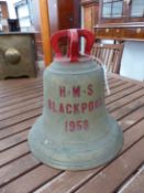 THE 1958 BELL FROM HMS BLACKPOOL, THE CROWN TOP PAINTED RED. H 29cms.