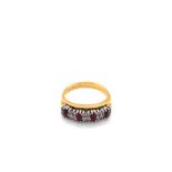 A RUBY AND DIAMOND TWO ROW HALF HOOP RING. UNHALLMARKED, STAMPED 18KT, ASSESSED AS 18ct GOLD. FINGER