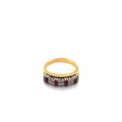 A RUBY AND DIAMOND TWO ROW HALF HOOP RING. UNHALLMARKED, STAMPED 18KT, ASSESSED AS 18ct GOLD. FINGER