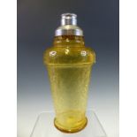 AN ART DECO METAL CAPPED STRAW YELLOW CRACKLED GLASS COCKTAIL SHAKER. H 23cms.