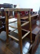 AN ANTIQUE OAK STOOL TOGETHER WITH A BRASS MOUNTED COALBOX