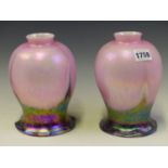 A PAIR OF INVERTED THISTLE SHAPED GLASS SHADES, THE ROUNDED UPPER PARTS IN PINK IRIDESCENT, THE