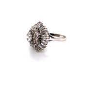 A DIAMOND BALLERINA STYLE CLUSTER RING, THE CENTRAL DIAMOND SURROUNDED BY A MULTI CLUSTER OF