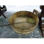 AN ANTIQUE IRON COOPERED TWO HANDLED TUB TOGETHER WITH A BRASS SKIMMER WITH AN IRON STRAP HANDLE