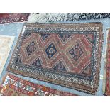 AN ANTIQUE PERSIAN TRIBAL RUG 168 x 110 cms