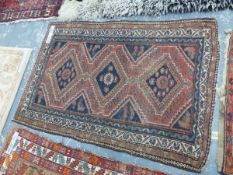 AN ANTIQUE PERSIAN TRIBAL RUG 168 x 110 cms