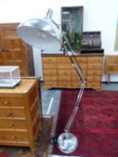 A GIANT CHROME FLOOR STANDING ANGLE POISE LAMP TOGETHER WITH A ALUMINIUM CEILING SHADE.