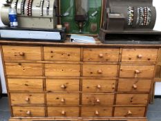 A 19th C. AND LATER PINE DRESSER BASE WITH FOUR BANKS OF FIVE DRAWERS ABOVE BRACKET FEET. W 166 x