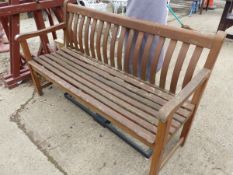 A TEAK GARDEN BENCH.