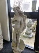 A COMPOSITE GARDEN FIGURE OF A LADY WITH LONG HAIR WITH A SEA SHELL BASE DECORATION.