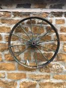 A SMALL CAST IRON WHEEL DIAMETER 63cms. VIEWING FOR THIS ITEM IS BY APPOINTMENT ONLY, AND IS NOT