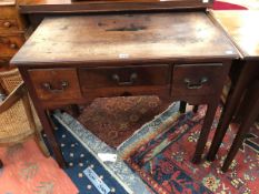 AN 18th C. MAHOGANY LOWBOY, THE SIDES AND FRONT EDGE OF THE RECTANGULAR TOP CHANNELLED ABOVE THREE