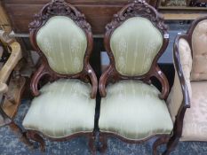 A PAIR OF VICTORIAN MAHOGANY SHOW FRAME CHAIRS, CRESTED BY RIBBON AND SCROLL CARVING, THE SERPENTINE