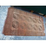 AN ANTIQUE AFGHAN RUG. 204 x 128cms TOGETHER WITH A BELOUCH RUG. 138 x 85cms (2)