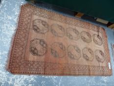 AN ANTIQUE AFGHAN RUG. 204 x 128cms TOGETHER WITH A BELOUCH RUG. 138 x 85cms (2)