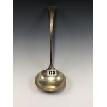 A SILVER SOUP LADLE BY DAVID AND GEORGE EDWARD, SHEFFIELD 1912, THE TOP OF THE HANDLE WITH A