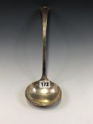 A SILVER SOUP LADLE BY DAVID AND GEORGE EDWARD, SHEFFIELD 1912, THE TOP OF THE HANDLE WITH A