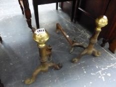 A PAIR OF IRON FIRE DOGS WITH BRASS BALL TOPS