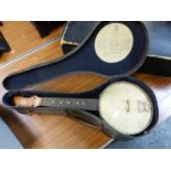 A VINTAGE UKULELE BANJO, JOHN GREY & SONS NAMED ON HEAD STOCK ON BACK AND ON INSIDE AND OUTSIDE OF