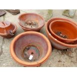 SEVEN TERRACOTTA PROVING POTS OF VARIOUS SIZES