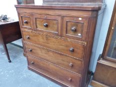 A VICTORIAN MAHOGANY CHEST OF THREE SHORT DRAWERS AND THREE GRADED LONG DRAWERS ON DISC FEET. W