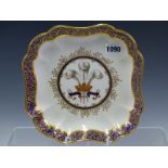 A PUCE MARKED DERBY SQUARE DISH PAINTED CENTRALLY WITH THE PRINCE OF WALES CREST AND MOTTO ICH