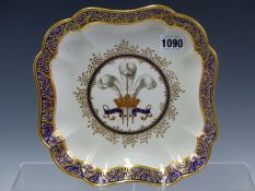 A PUCE MARKED DERBY SQUARE DISH PAINTED CENTRALLY WITH THE PRINCE OF WALES CREST AND MOTTO ICH